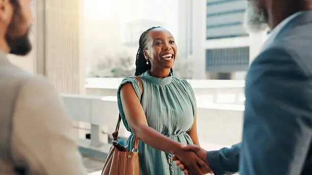 A smiling landlord shaking hands